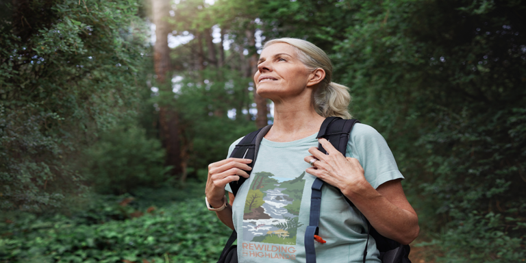Lady in nature wearing nature scape t-shirt
